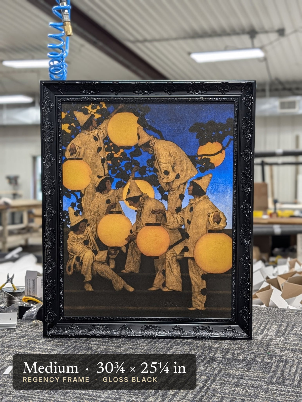 Regency Gloss Black frame on a painting at our worktable