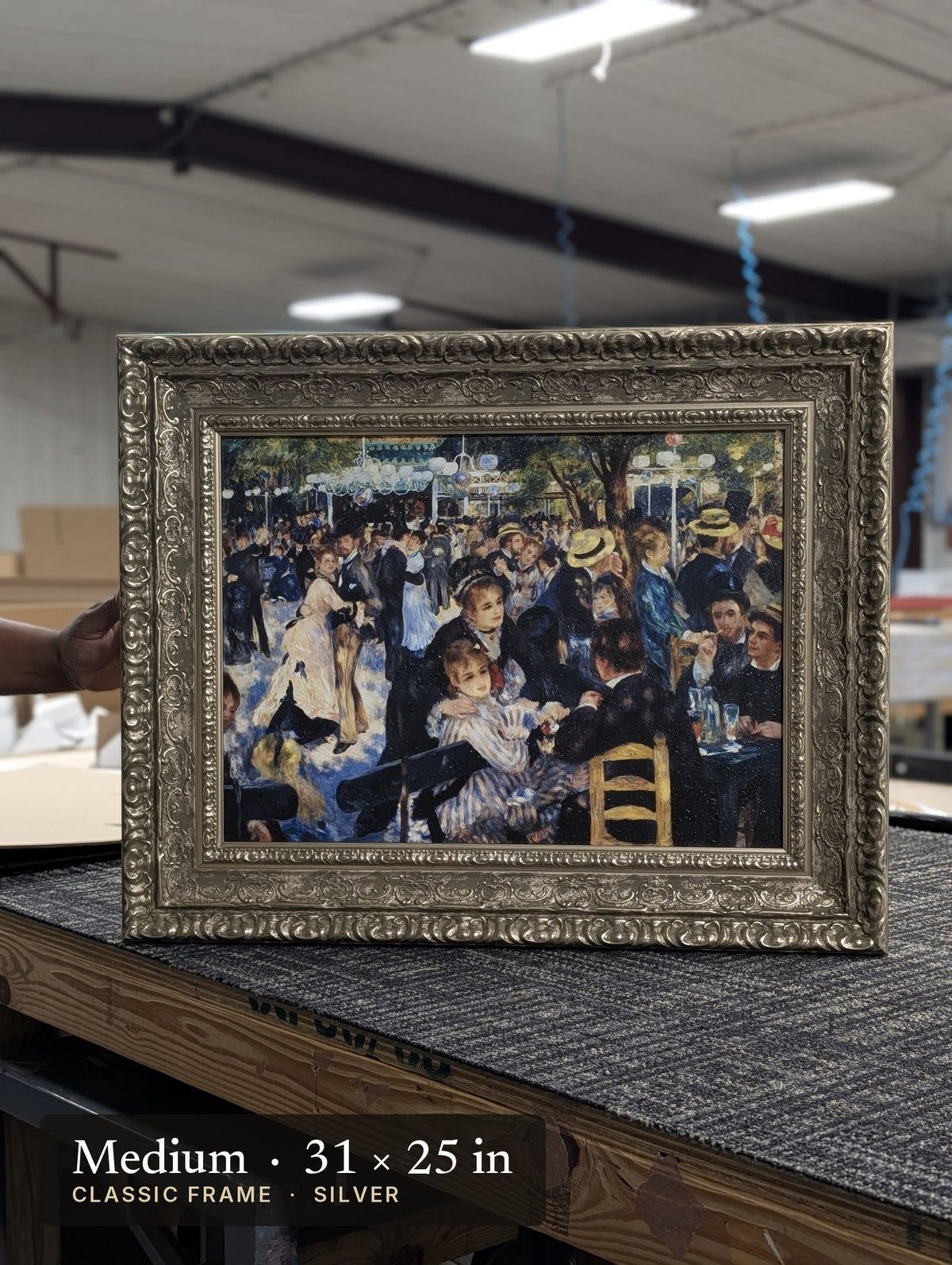 Classic Silver frame on a painting at our worktable